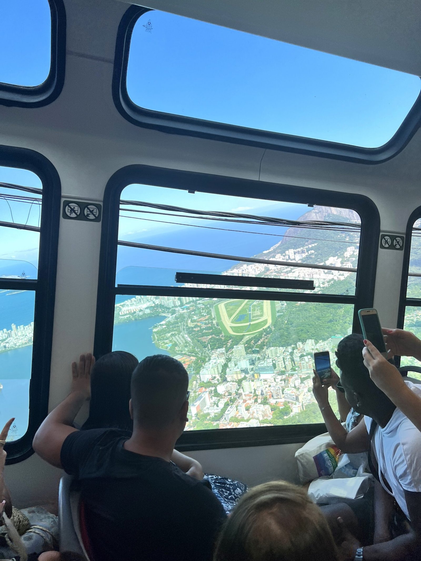 people taking pictures of the view in rio de janeiro